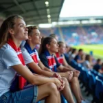 Jeunes supporters parisiens au stade Charléty regardant le match